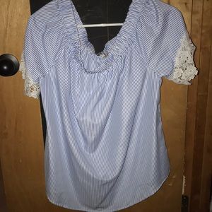 White and blue striped blouse. Crochet sleeves.